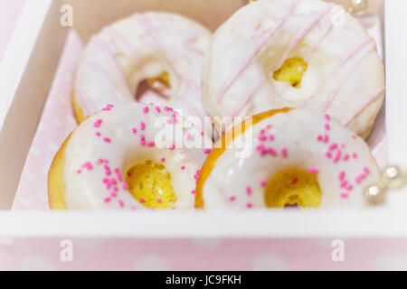 White icing doughnuts in decorated  gift box Stock Photo