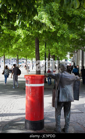 Statue of Man Against red Letterbox on Avenida Dos Aliados in Porto - Portugal Stock Photo