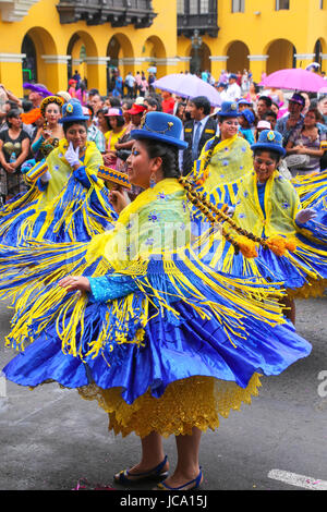 Local women dancing during Festival of the Virgin de la Candelaria in Lima, Peru. The core of the festival is dancing and music performed by different Stock Photo