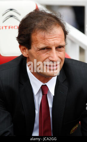 AC Milan coach Massimiliano Allegri (left) gestures in frustration as Arsenal manager Arsene