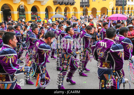 Local men dancing during Festival of the Virgin de la Candelaria in Lima, Peru. The core of the festival is dancing and music performed by different d Stock Photo