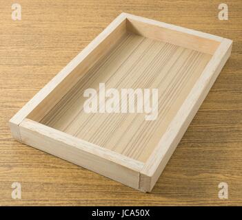 Empty Wooden Serving Tray in Rectangular Forms on A Table, For Carrying Things. Stock Photo