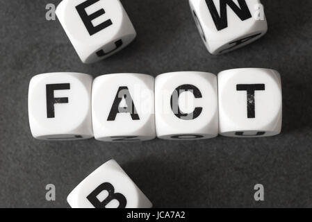 word fact on white toy cubes Stock Photo