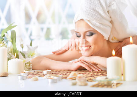 Beautiful young woman having a back massage Stock Photo