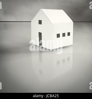 handmade paper work white house that reflect on a glossy surface Stock Photo