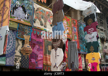 Clothes displayed on the outside of a building in the narrow streets around Durbar Square, Kathmandu, Nepal Stock Photo