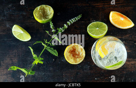 Preparing Lemon Water on Wooden Table for Meal. Source for Anti Oxidants Stock Photo