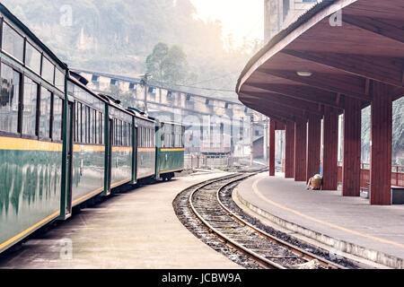 Evening view of the narrow-gauge Yuejin station by the coal loading point. Jiayang Mining Region. Sichuan province. China. Stock Photo
