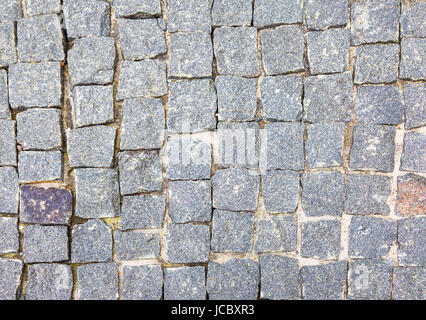 Texture of cobblestone road close-up. Stock Photo