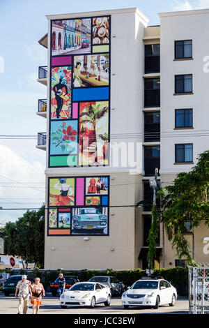 Miami Florida,Little Havana,neighborhood,high-rise,residential building,mural,art,parking lot,senior seniors citizen citizens,man men male,woman femal Stock Photo