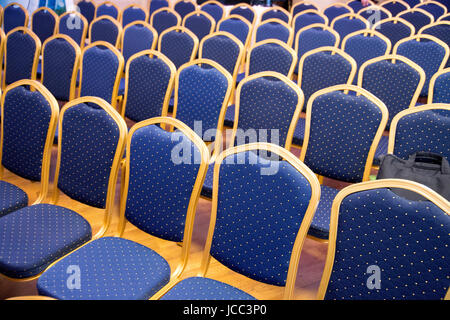 Empty conference chairs in row at a business room.  Comfortable seats in empty corporate meeting office for presentation Stock Photo