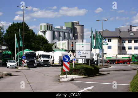 Mainz, Germany - June 10, 2017: Parking trucks are parked in front of the entrance to Heidelberg cement plant on June 10, 2017 in Mainz. Stock Photo