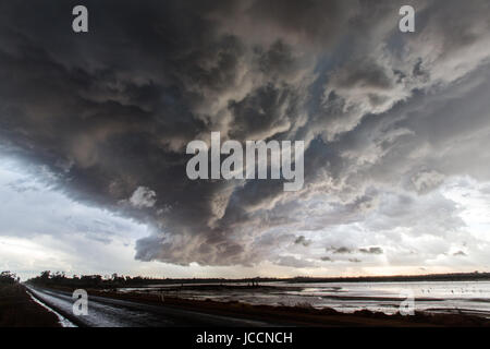 Storm passes over saline lake in the far north of Victoria Stock Photo