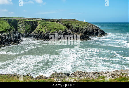 The coast at the harbour entrance to Porthgain Pembrokeshire, a small coastal viaalge very popular with visitors. Stock Photo