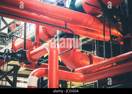 Various mechanisms and metal pipes from a Industrial Factory Stock Photo