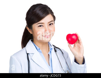 Medical female doctor with heart shape ball Stock Photo