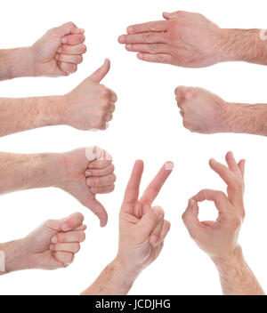Close-up Of Male Hand Showing Various Signs Over White Background Stock Photo