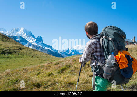 COL DE BALME, FRANCE - SEPTEMBER 01: Backpackers looking at view with Mont Blanc in the background. The area is a stage of the popular Mont Blanc tour. September 01, 2014 in Col de Balme. Stock Photo