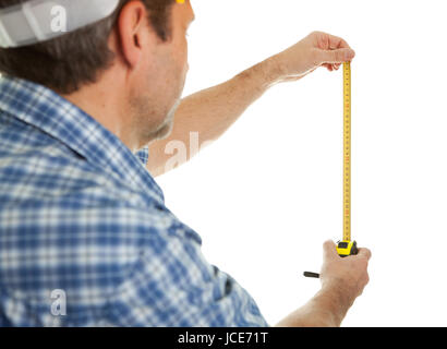 Confident worker using tape to measure dimensions. Isolated on white Stock Photo