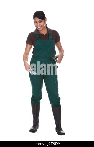 Young Female Gardner With Gardening Tools Isolated Over White Background Stock Photo