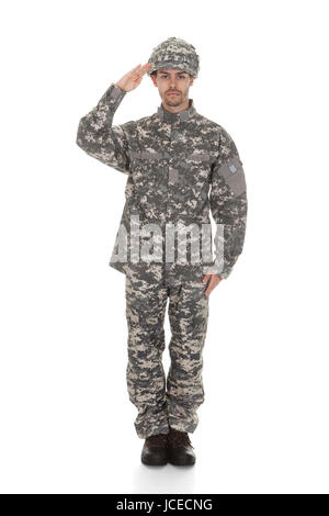 Young Army Soldier Saluting Over White Background Stock Photo