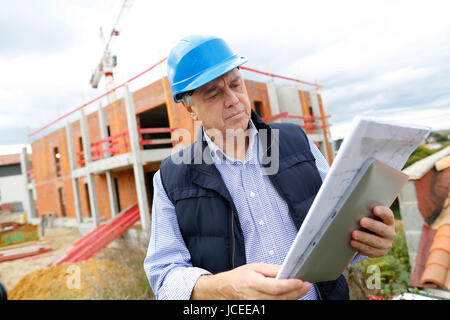 Building entrepreneur using digital tablet Stock Photo