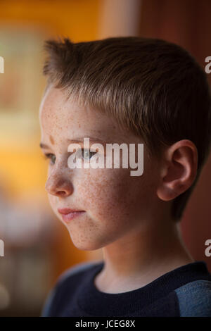 A determined and thoughtful 7 year old boy. Stock Photo