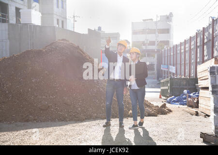 Architects at construction site Stock Photo
