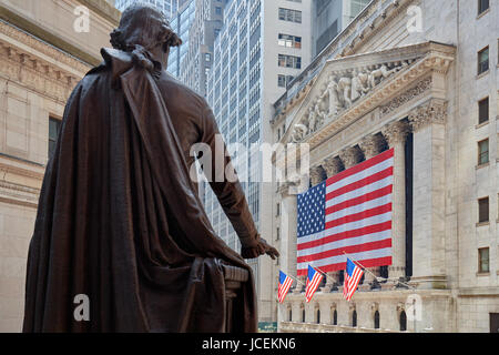 NEW YORK - SEPTEMBER 8: Wall Street Stock Exchange building with big US flag and George Washington statue back, financial district in New York Stock Photo