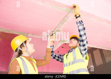 Side view portrait of construction workers Stock Photo