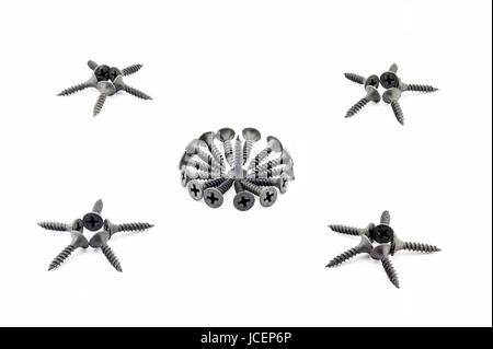Four five-pointed stars and a circular composition are lined with black Oxidized self-tapping screw isolated on white background Stock Photo