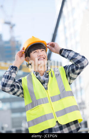 Young smiling construction worker Stock Photo