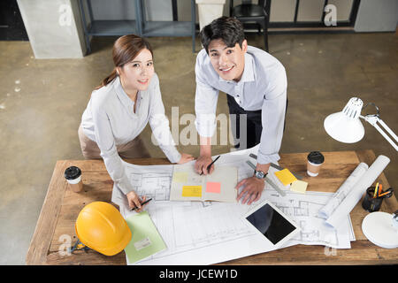 Young smiling architects working at office Stock Photo