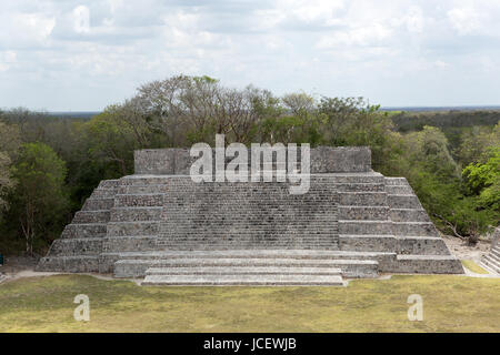 frontal image of a flat top Mayan pyramid in the archaeological site of Edzna, Campeche Stock Photo