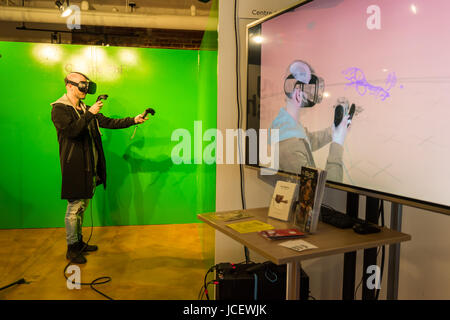 Montreal, 6 June 2017: Man creating 3D paintings using virtual reality software during Art Fair at Bonsecours Market Stock Photo