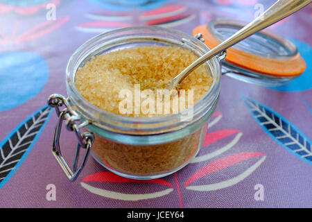 granulated brown sugar in kilner style glass jar Stock Photo