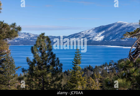 This is a winter image taken near Emerald Bay, overlooking Southern part of Lake Tahoe. In the distance you can see the Casinos and Heavenly Valley. Stock Photo