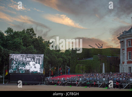 Horse Guards Parade, London UK. 15th June 2017. 2017 marks the 100th anniversary of Passchendaele, one of the bloodiest conflicts of the First World War. A new composition is performed, written by Major Simon Haw, Director of Music Coldsteam Guards Band at Beating Retreat, the words taken from Colour Sergeant Darren Hardy’s poem, 'Tyne Cot Passchendaele' which was written after a Battlefield Tour in 2013. The performance coincides with a dramatic sunset over central London. Credit: Malcolm Park / Alamy Live News. Stock Photo