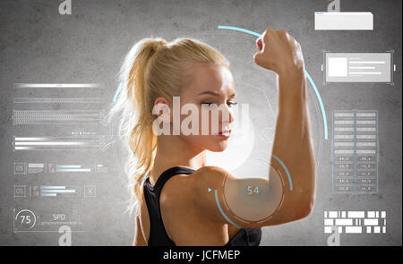young woman posing and showing muscles Stock Photo