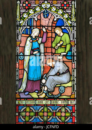 Corporal Acts of Mercy window, visiting the imprisoned, stained glass by Frederick Preedy, 1868, Gunthorpe, Norfolk Stock Photo