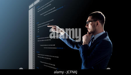 businessman with coding on virtual screen Stock Photo