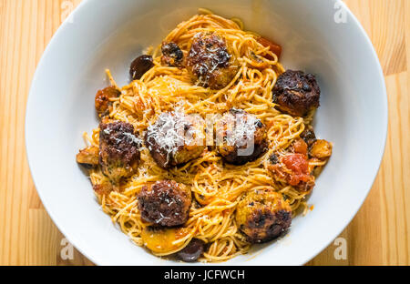 Spaghetti and Italian meatballs in a white bowl Stock Photo