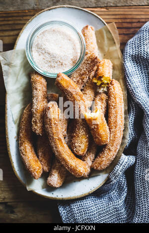 A churro, a fried dough sweet pastry based snack. Stock Photo