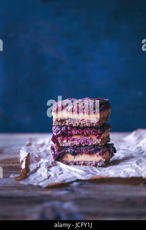 Stack of raw peanut butter and raspberry chia jam bars Stock Photo
