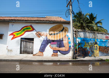 CARTAGENA, COLOMBIA, JANUARY 24: Graffiti in the old streets of Cartagena in Colombia. Made by Jade in 2013. Blue sky in the background. Stock Photo