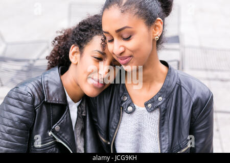 Two north African teen friends sitting together talking Stock Photo