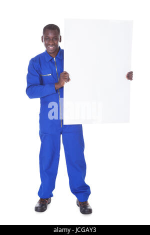 Worker Standing Holding Billboard Over White Background Stock Photo