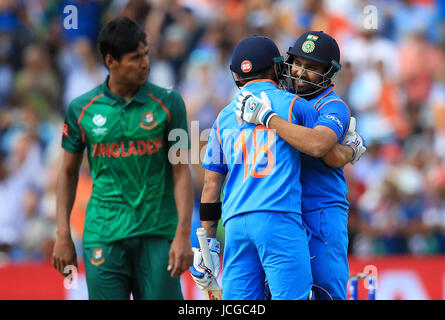 India's Rohit Sharma is congratulated on reaching his century by team-mate Virat Kohli during the ICC Champions Trophy, semi-final match at Edgbaston, Birmingham. Stock Photo