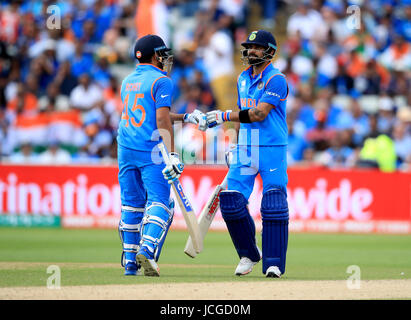 India's Virat Kohli (right) and Rohit Sharma (left) bump gloves during the ICC Champions Trophy, semi-final match at Edgbaston, Birmingham. Stock Photo