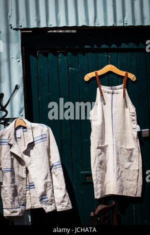 Vintage and secondhand clothes and objects jostle for space athe Columbia Road Flower Market, London Stock Photo